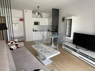 a living room with a couch and a table at Malborska 29 in Kraków