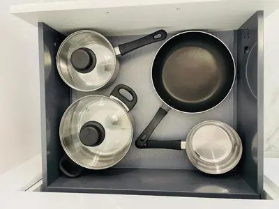a box with four pots and pans in it at Malborska 29 in Kraków