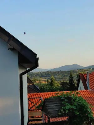 a view of a roof of a building with a bench at Domki Na Wiosce in Stryszowa