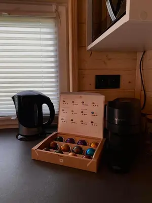 a box of donuts sitting on the floor in a kitchen at Domki Na Wiosce in Stryszowa