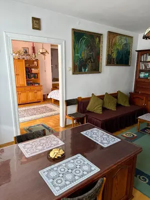 a living room with a table and a couch at Perfect Remote-Workplace in Sunny Apartment in Myślenice