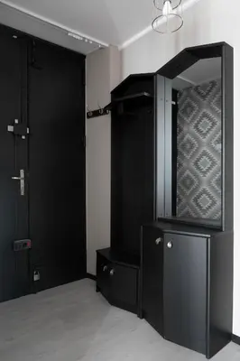a room with two black doors and a mirror at Large Apartment next to Main Station - 85 m2 in Kraków