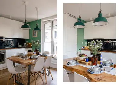 a kitchen and a dining room with green and white cabinets at Nadwiślańska11 - Klimatyczny apartament tuż nad Wisłą in Kraków