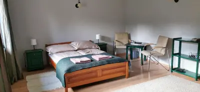 a bedroom with a bed with two towels on it at Dom Gościnny Zawoja in Zawoja