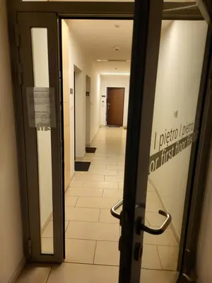 an open door to a hallway in a hospital at AMBER APARTAMENt 108 in Kraków