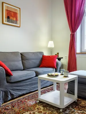 a living room with a couch and a table at Central Apartments by Tyzenhauz in Kraków