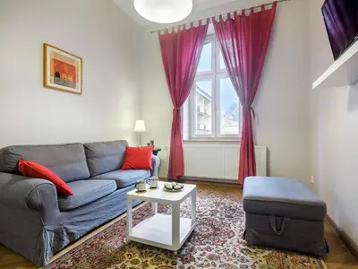 a living room with a couch and a table at Central Apartments by Tyzenhauz in Kraków