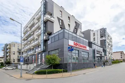 a building on the corner of a street at Mondrian Cracow - 2 Bedroom Apartment for Home Office by Noclegi Renters in Kraków