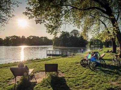 a group of bikes parked next to a lake at Nowa Huta Super Star in Kraków