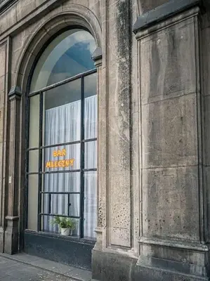 a large window of a building with a sign in it at Nowa Huta Super Star in Kraków
