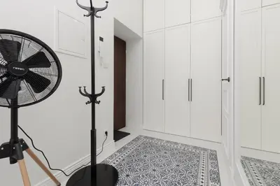 a room with a fan and a rug at Apartment Strzelecka Old Town Cracow by Renters Prestige in Kraków