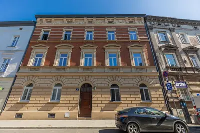 a building with a car parked in front of it at Apartment Strzelecka Old Town Cracow by Renters Prestige in Kraków