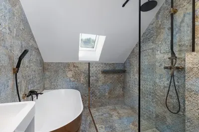 a bathroom with a shower and a toilet and a sink at The Historic Kazimierz District - Apartments with parking by Noclegi Renters in Kraków