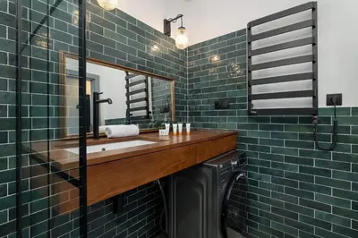 a bathroom with a sink and a mirror at Solna Cracow Air-conditioned Apartment with Balcony by Noclegi Renters in Kraków