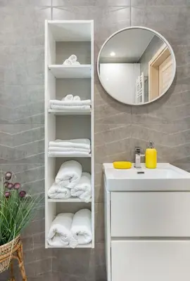 a bathroom with a white sink and a mirror at Staymoovers - ManiaLand Domki pod Krakowem in Paszkówka