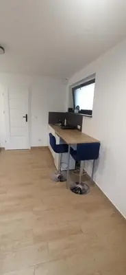 an office with a desk and a computer in a room at Kaim Hill Cracow Chillout Zone in Kraków