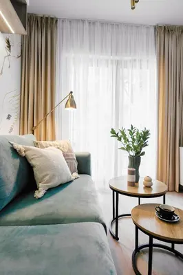 a living room with a couch and a table at Golden Dreams Luxury Apartments 21 in Kraków
