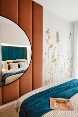 a bedroom with a mirror above a bed at Golden Dreams Luxury Apartments 21 in Kraków