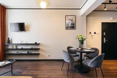 a dining room with a table and chairs at Estery12 in Kraków