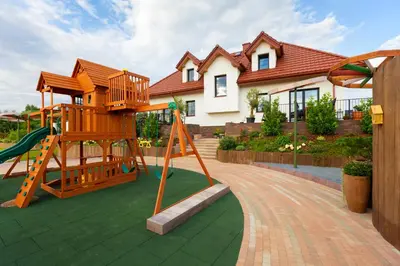 a playground in front of a house at Lisie Sprawki in Bebło