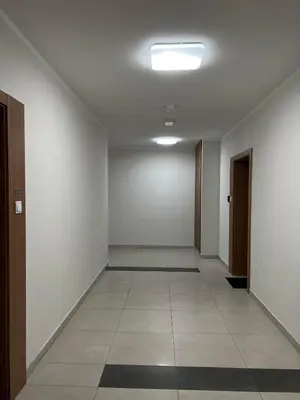 an entrance to a building with a glass door at Parkcity Kraków pro in Kraków
