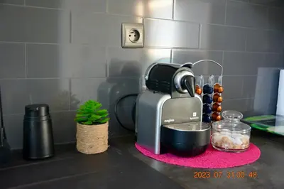a coffee maker on a counter next to a sink at Apartment near Old Town in Kraków