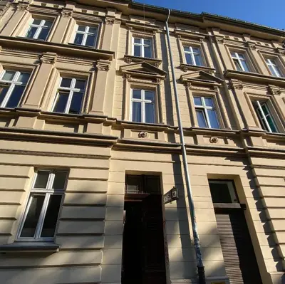 a building with a street sign in front of it at Apartment near Old Town in Kraków