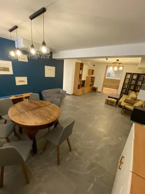 a room with a table and chairs and a couch at Stara Plebania in Ponice