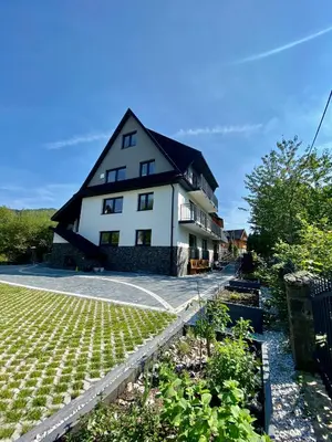 a house with a garden in front of it at Stara Plebania in Ponice