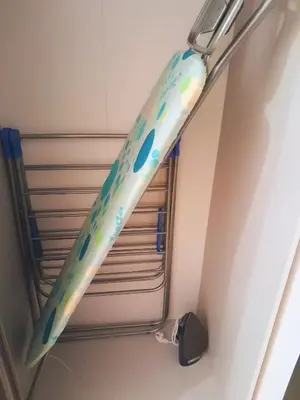 a toothbrush hanging from the ceiling of a bathroom at Apartament Hubertus in Bochnia