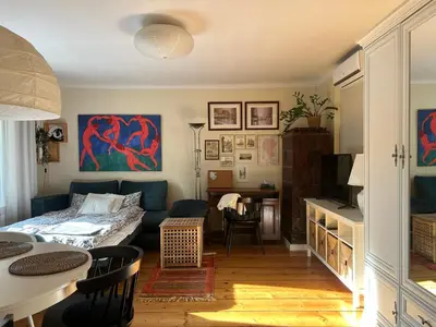 a living room with a couch and a table at Apartament na starej Krowodrzy in Kraków
