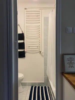 a bathroom with a shower with a toilet and a sink at Apartament na starej Krowodrzy in Kraków
