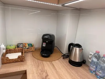a coffee maker sitting in a corner of a room at Apartament Stare Miasto in Kraków