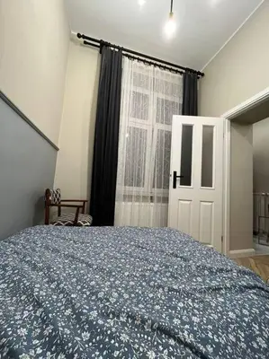 a bedroom with a large bed and a window at Nobel Apartment - BEST LOCATION! in Kraków