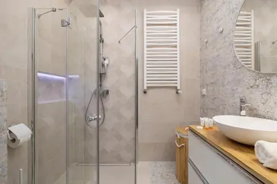 a bathroom with a sink and a shower at Modern Studio Kazimierz for 4 Guests only 1 km to Wawel Castle by Noclegi Renters in Kraków