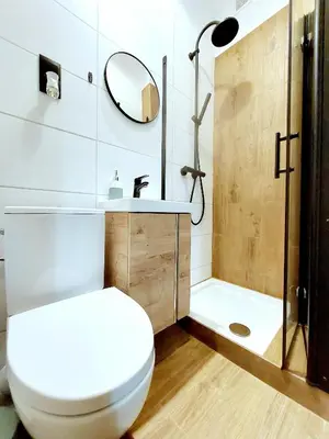 a bathroom with a toilet and a shower and a sink at Krakowskim Szlakiem - OLD TOWN in Kraków