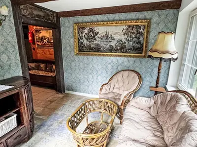a living room with two chairs and a couch at Holiday Home Bastrówka by Interhome in Chrosna