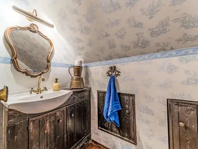 a bathroom with a sink and a mirror at Holiday Home Bastrówka by Interhome in Chrosna
