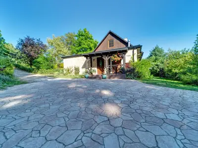 a stone driveway in front of a house at Holiday Home Bastrówka by Interhome in Chrosna