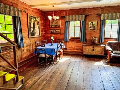 a dining room with a table and chairs at Holiday Home Bastrówka by Interhome in Chrosna