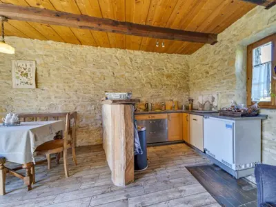 a kitchen with a table and a table and a tableablish at Holiday Home Jura dla Ciebie by Interhome in Cisowa