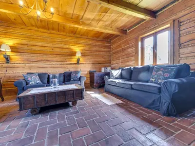 a living room with a couch and a coffee table at Holiday Home Jura dla Ciebie by Interhome in Cisowa
