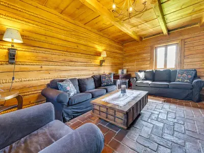 a living room with couches and a coffee table at Holiday Home Jura dla Ciebie by Interhome in Cisowa