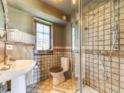 a bathroom with a toilet and a sink and a shower at Holiday Home Jura dla Ciebie by Interhome in Cisowa
