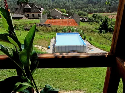 a view of a swimming pool from a window at Holiday Home Moja Mała Toskania by Interhome in Cisowa
