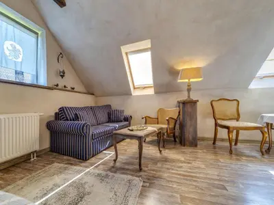 a living room with a couch and chairs and a table at Holiday Home Moja Mała Toskania by Interhome in Cisowa