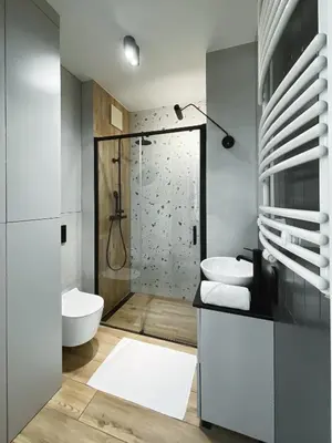 a bathroom with a shower and a toilet and a sink at Like Home Apartments in Kraków