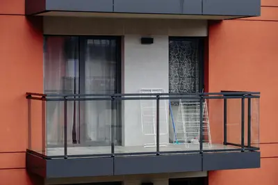 a balcony with a window on a building at Like Home Apartments in Kraków