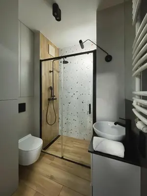 a bathroom with a shower and a toilet and a sink at Like Home Apartments in Kraków