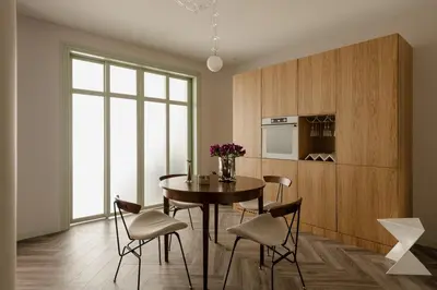 a dining room with a table and some chairs at Sage Apartment in Kraków